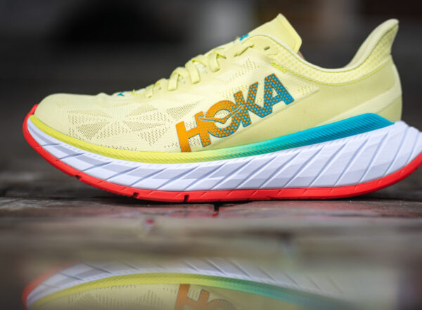 Bangkok, Thailand – May 2021 : HOKA running is launch the new “Carbon X 2” in light yellow color. This shoe is the top running shoe designed for pace performance. Close-up and selective focus.
